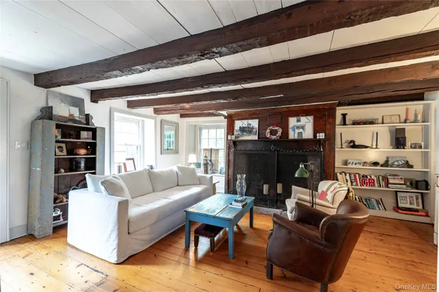a living room with furniture a lamp and a fireplace