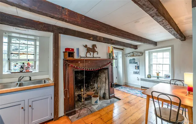 a view of a livingroom with furniture window and wooden floor
