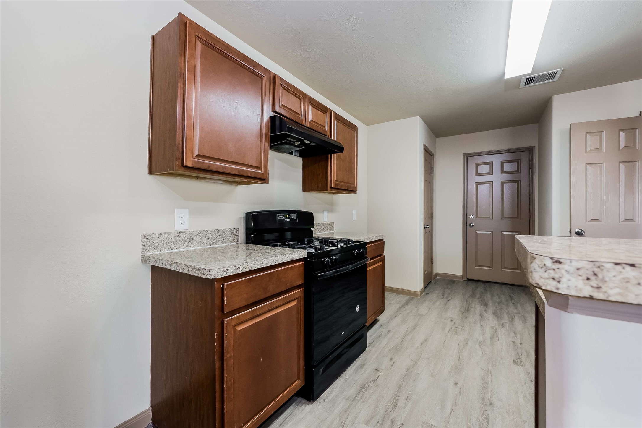 2410 Connors Path Court Houston, TX 77073 - Photo 3 of 12 a kitchen with stainless steel appliances granite countertop a stove and a refrigerator