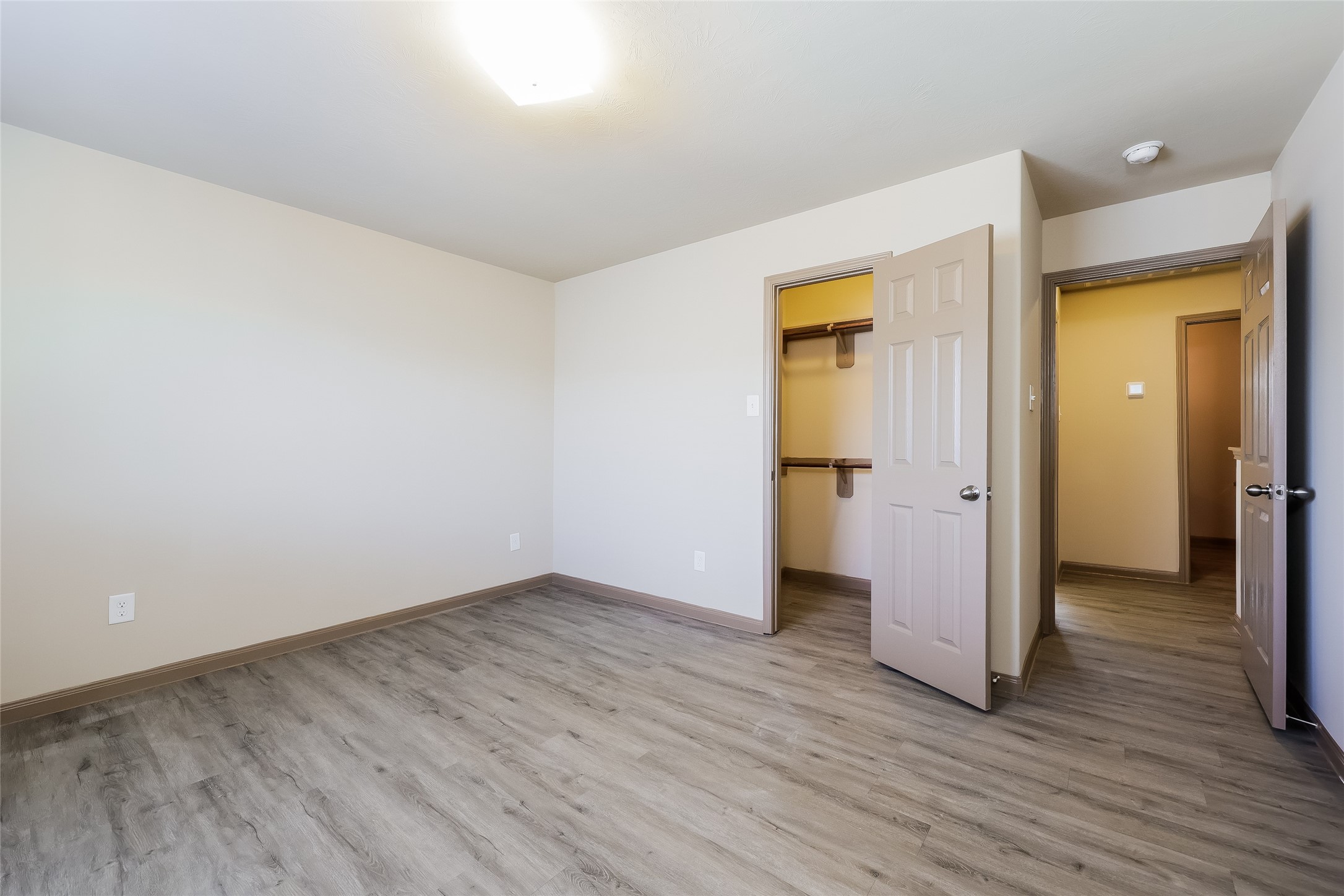 2410 Connors Path Court Houston, TX 77073 - Photo 6 of 12 an empty room with wooden floor and closet
