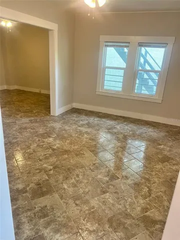 a view of an empty room with a window