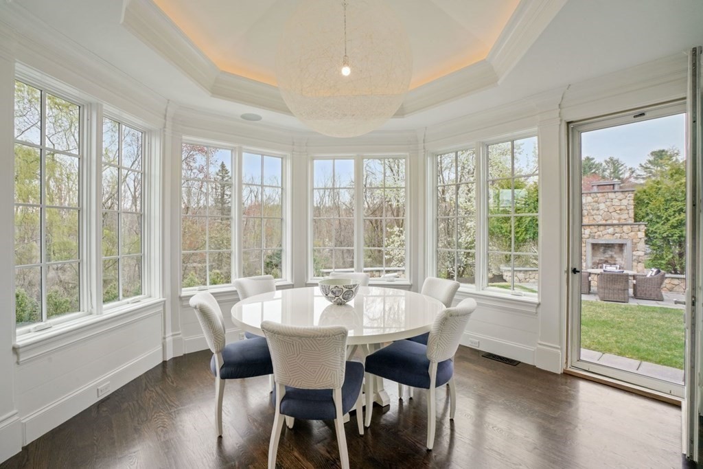 64 Cartwright Road Needham, MA 02492 - Photo 14 of 40 a view of a dining room with furniture window and wooden floor