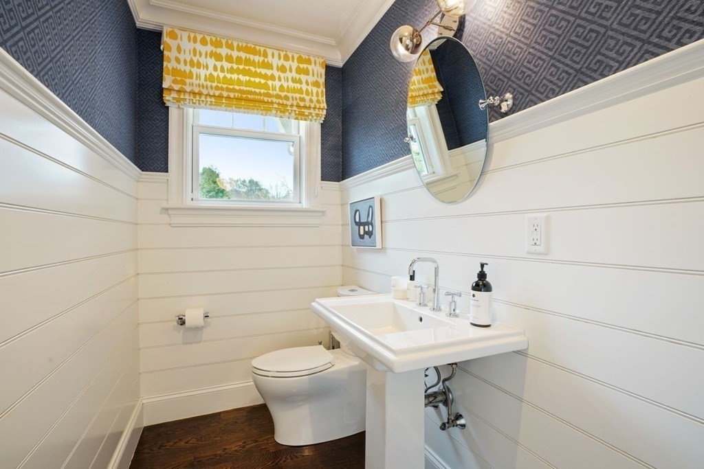 64 Cartwright Road Needham, MA 02492 - Photo 20 of 40 a bathroom with a sink a toilet and mirror