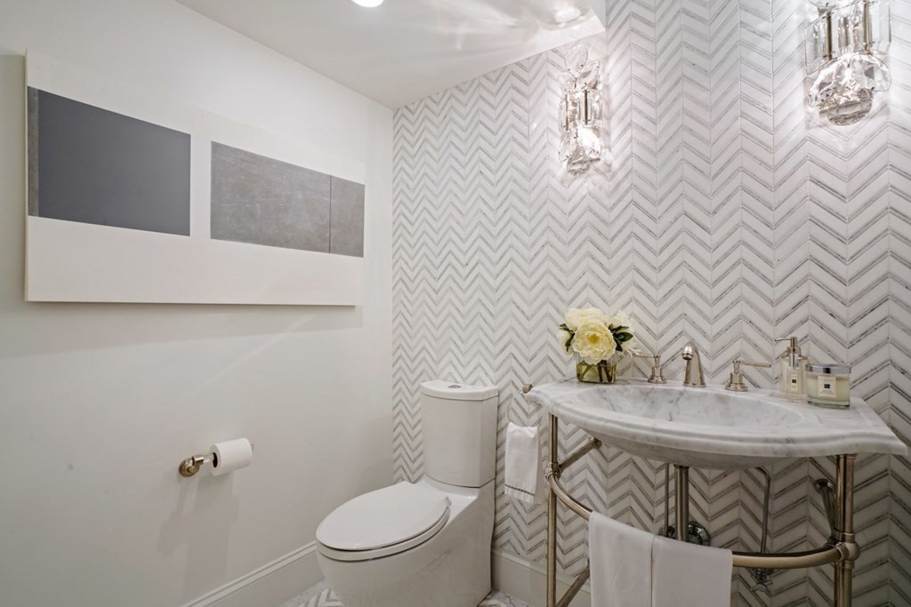64 Cartwright Road Needham, MA 02492 - Photo 21 of 40 a bathroom with a sink and a toilet