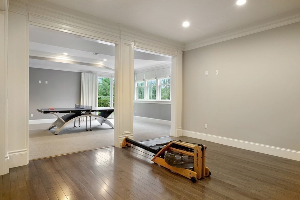 64 Cartwright Road Needham, MA 02492 - Photo 29 of 40 a living room with furniture and a wooden floor