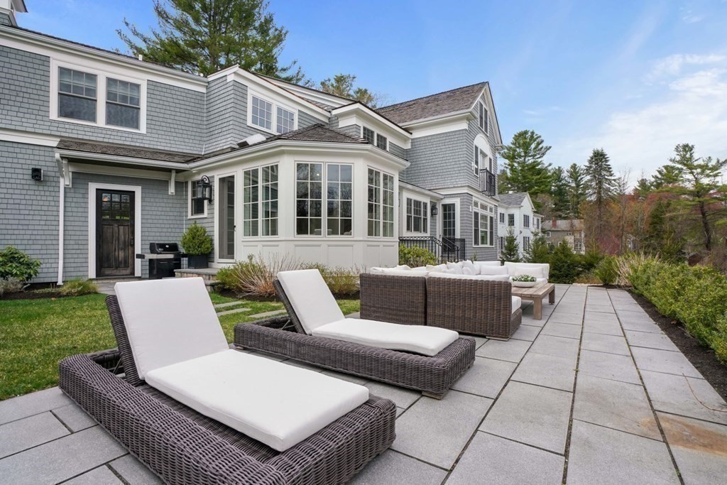 64 Cartwright Road Needham, MA 02492 - Photo 33 of 40 a view of a patio with couches table and chairs and potted plants
