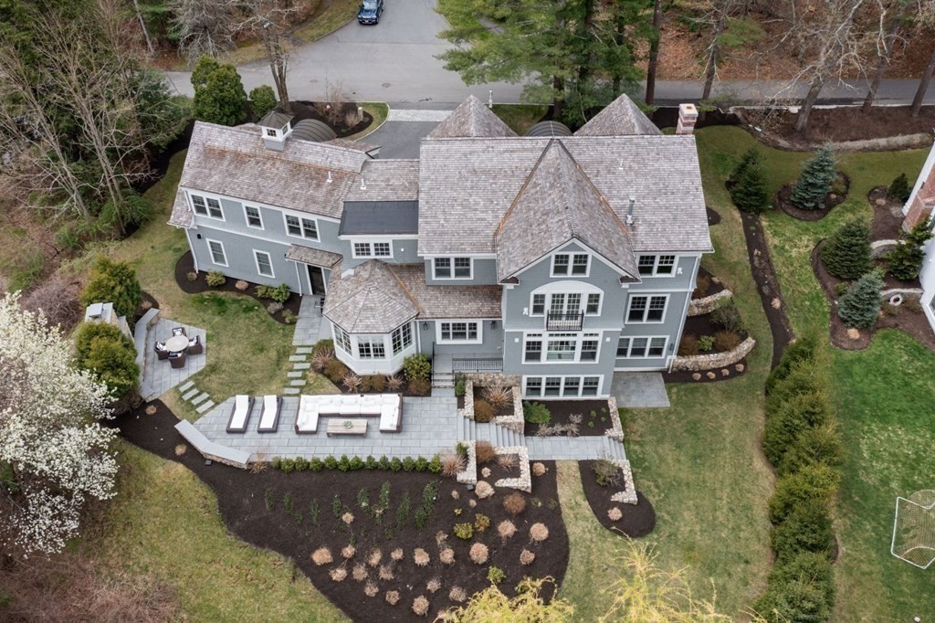 64 Cartwright Road Needham, MA 02492 - Photo 38 of 40 an aerial view of a house with a garden potted plants and large trees