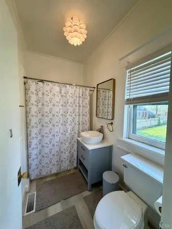 a kitchen with granite countertop a refrigerator oven a sink dishwasher and a stove with wooden floor