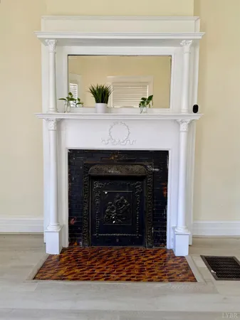 a living room with a fireplace and a fireplace