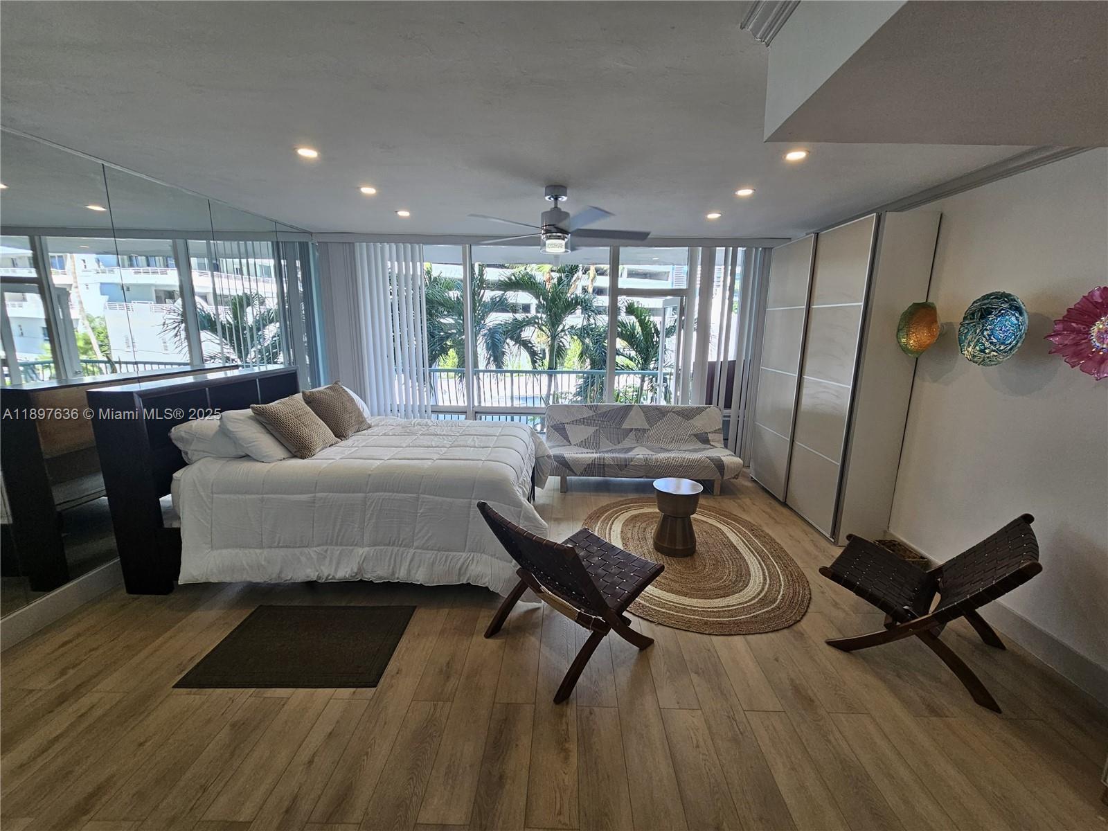 1408 Brickell Bay Drive, Unit 316 Miami, FL 33131 - Photo 11 of 19 a living room with furniture and a large window
