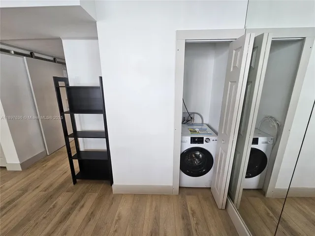 a view of a porch with a table and chairs