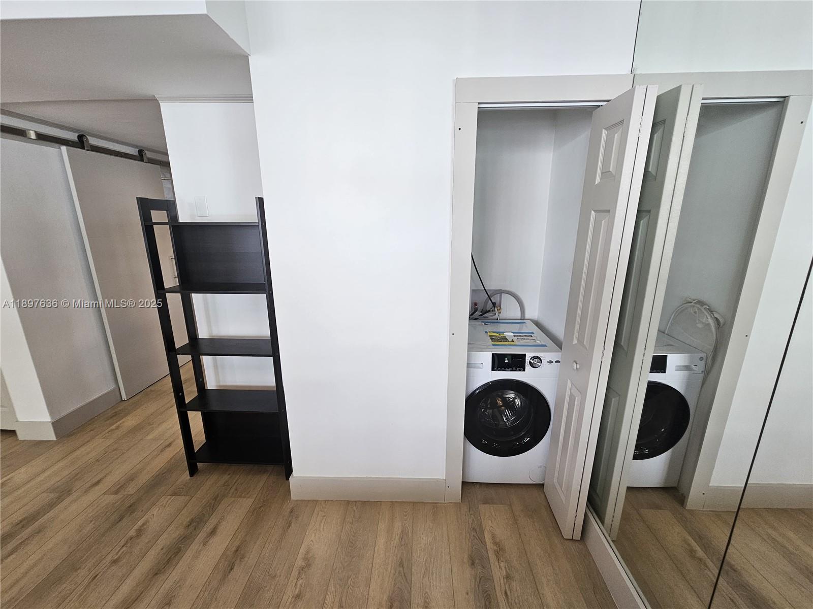 1408 Brickell Bay Drive, Unit 316 Miami, FL 33131 - Photo 18 of 19 a view of entryway with wooden floor