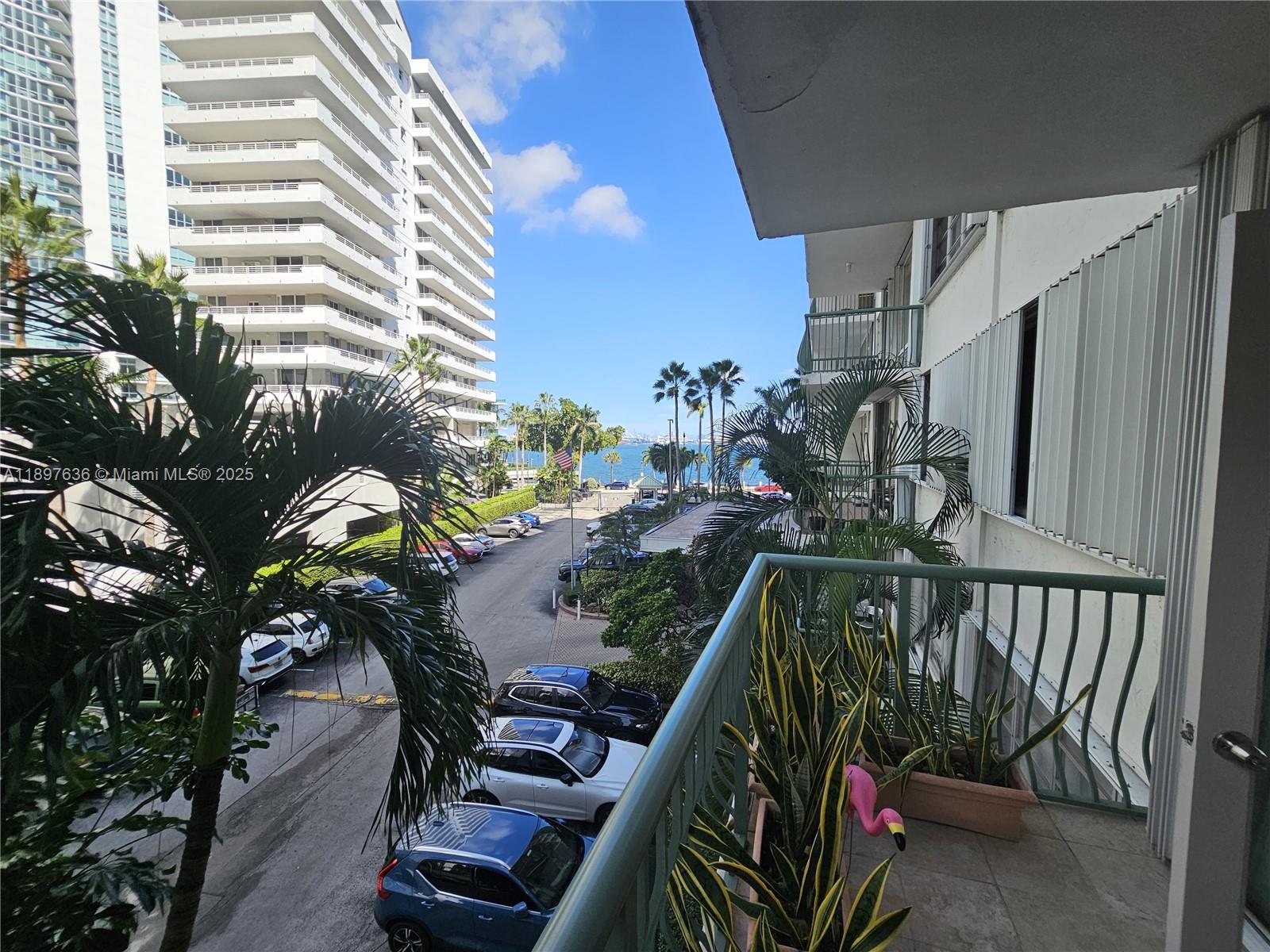 1408 Brickell Bay Drive, Unit 316 Miami, FL 33131 - Photo 5 of 19 a view of a balcony with chairs