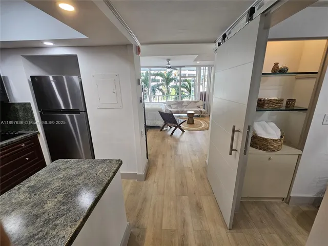 a view of a livingroom with furniture and wooden floor