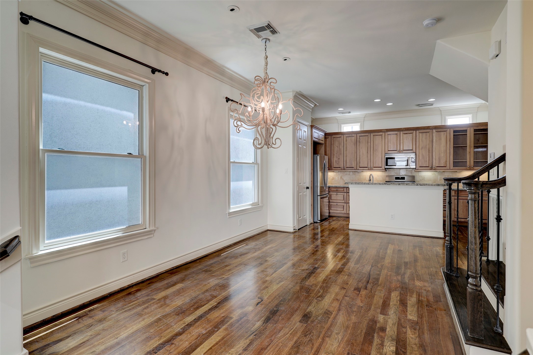 1436 Wichita Street Houston, TX 77004 - Photo 17 of 47 a kitchen with stainless steel appliances granite countertop a refrigerator a sink dishwasher a stove and white countertops with wooden floor