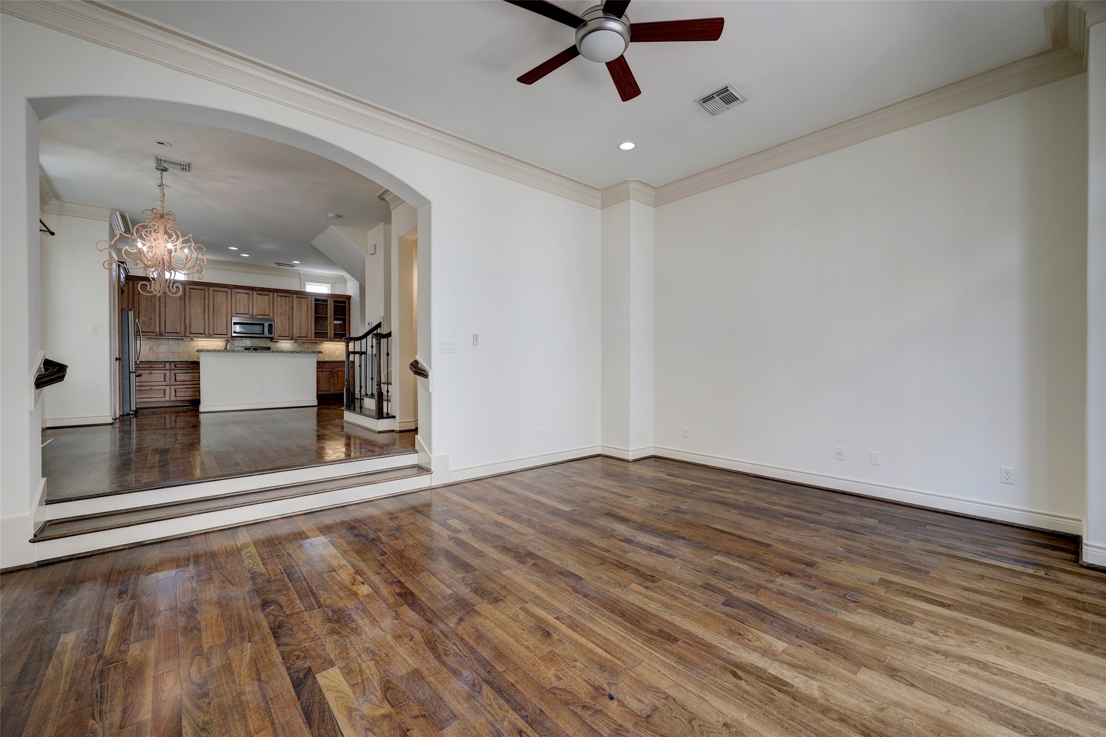 1436 Wichita Street Houston, TX 77004 - Photo 19 of 47 wooden floor in an empty room with a kitchen