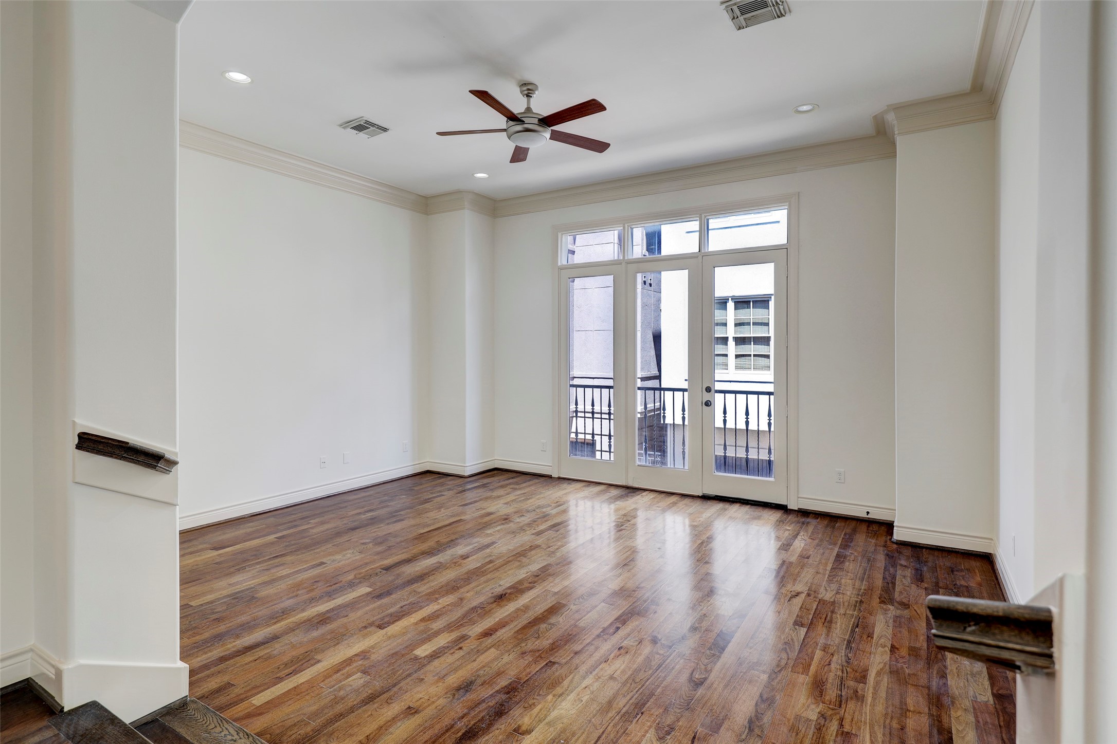1436 Wichita Street Houston, TX 77004 - Photo 20 of 47 a view of an empty room with wooden floor and a window