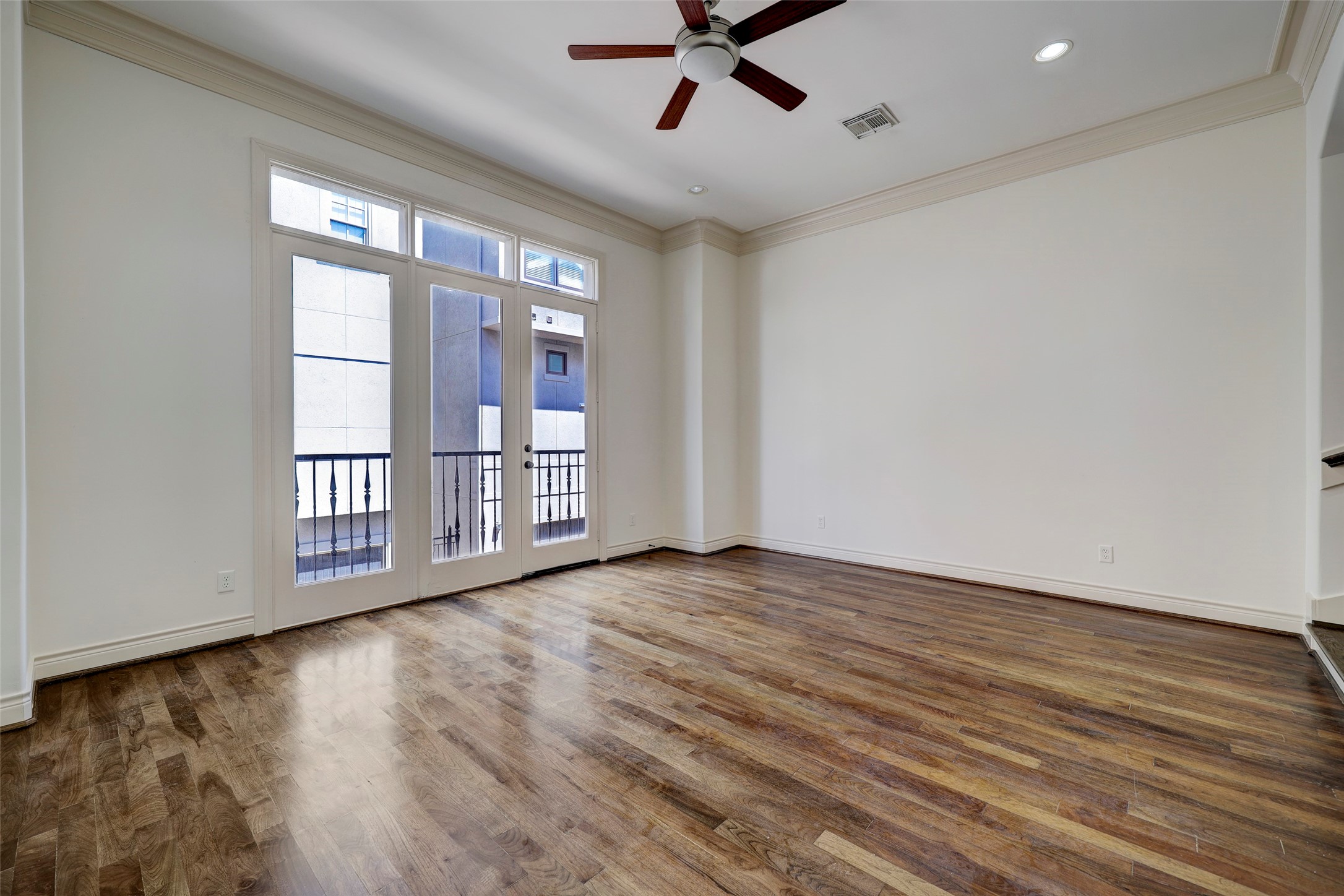 1436 Wichita Street Houston, TX 77004 - Photo 22 of 47 a view of an empty room with a window and wooden floor