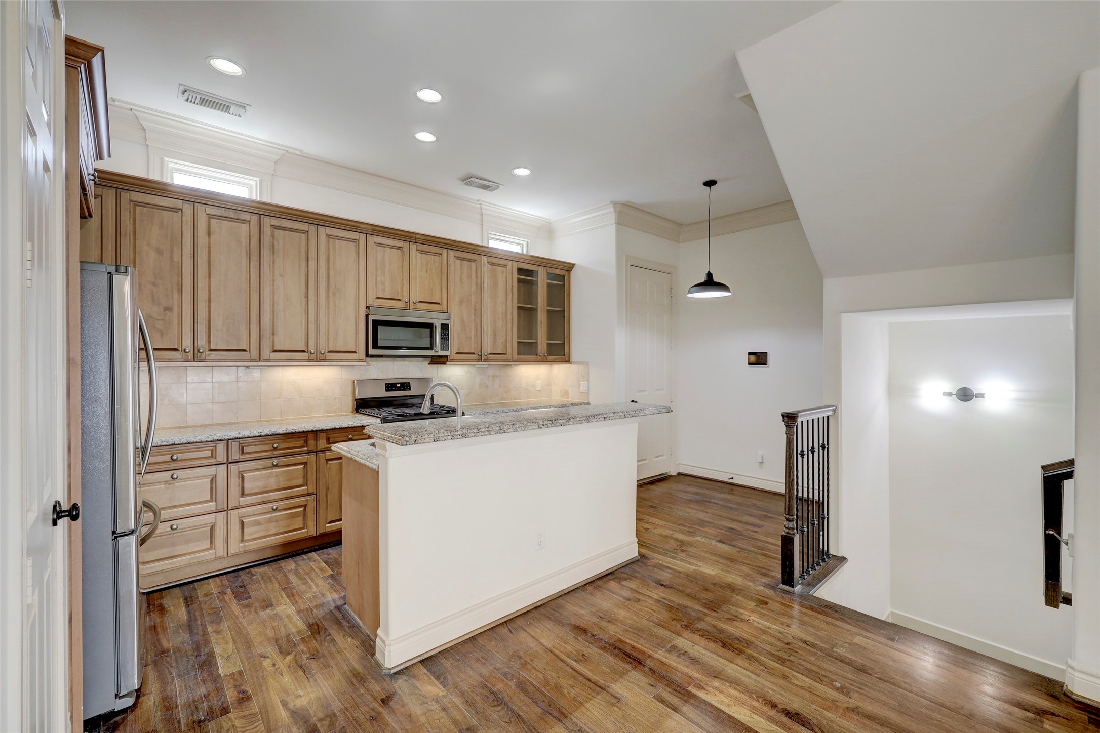 1436 Wichita Street Houston, TX 77004 - Photo 26 of 47 a kitchen with stainless steel appliances granite countertop a refrigerator and a stove top oven