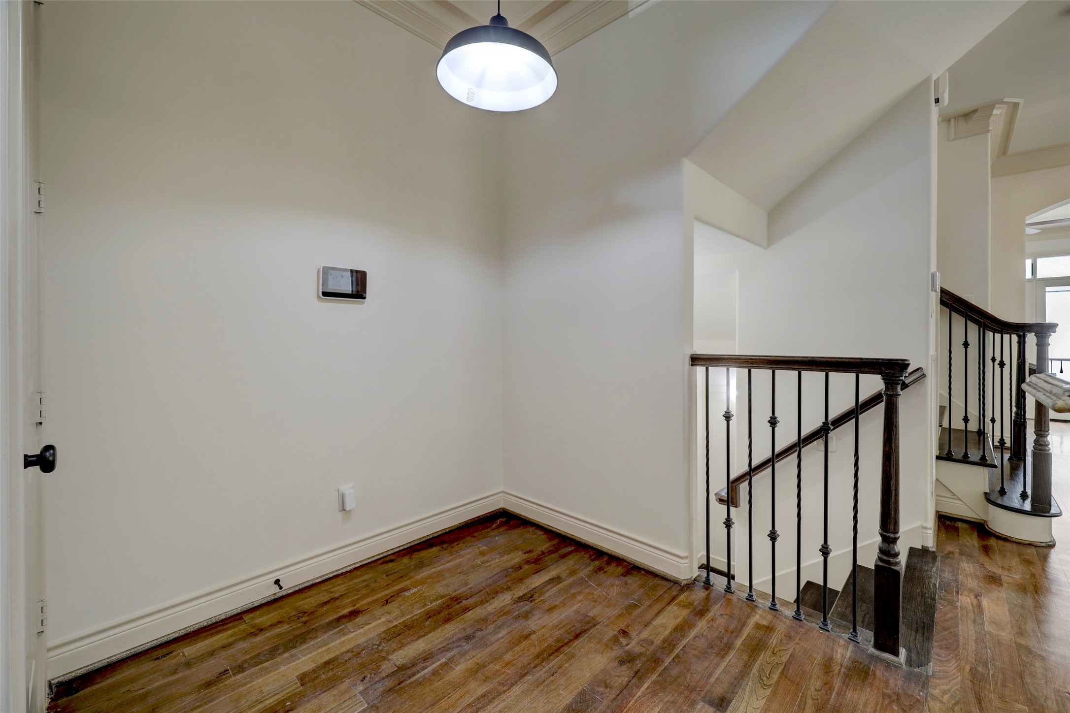 1436 Wichita Street Houston, TX 77004 - Photo 28 of 47 a view of a room with wooden floor and stairs