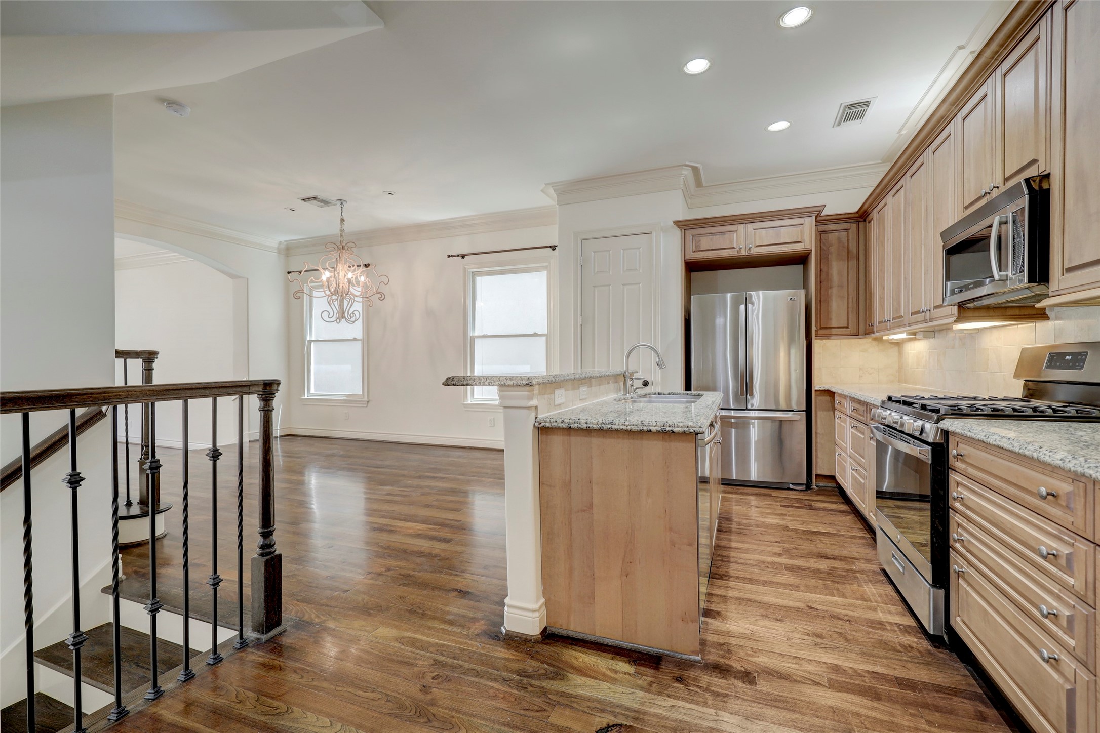 1436 Wichita Street Houston, TX 77004 - Photo 31 of 47 a kitchen with stainless steel appliances granite countertop a refrigerator and a stove top oven