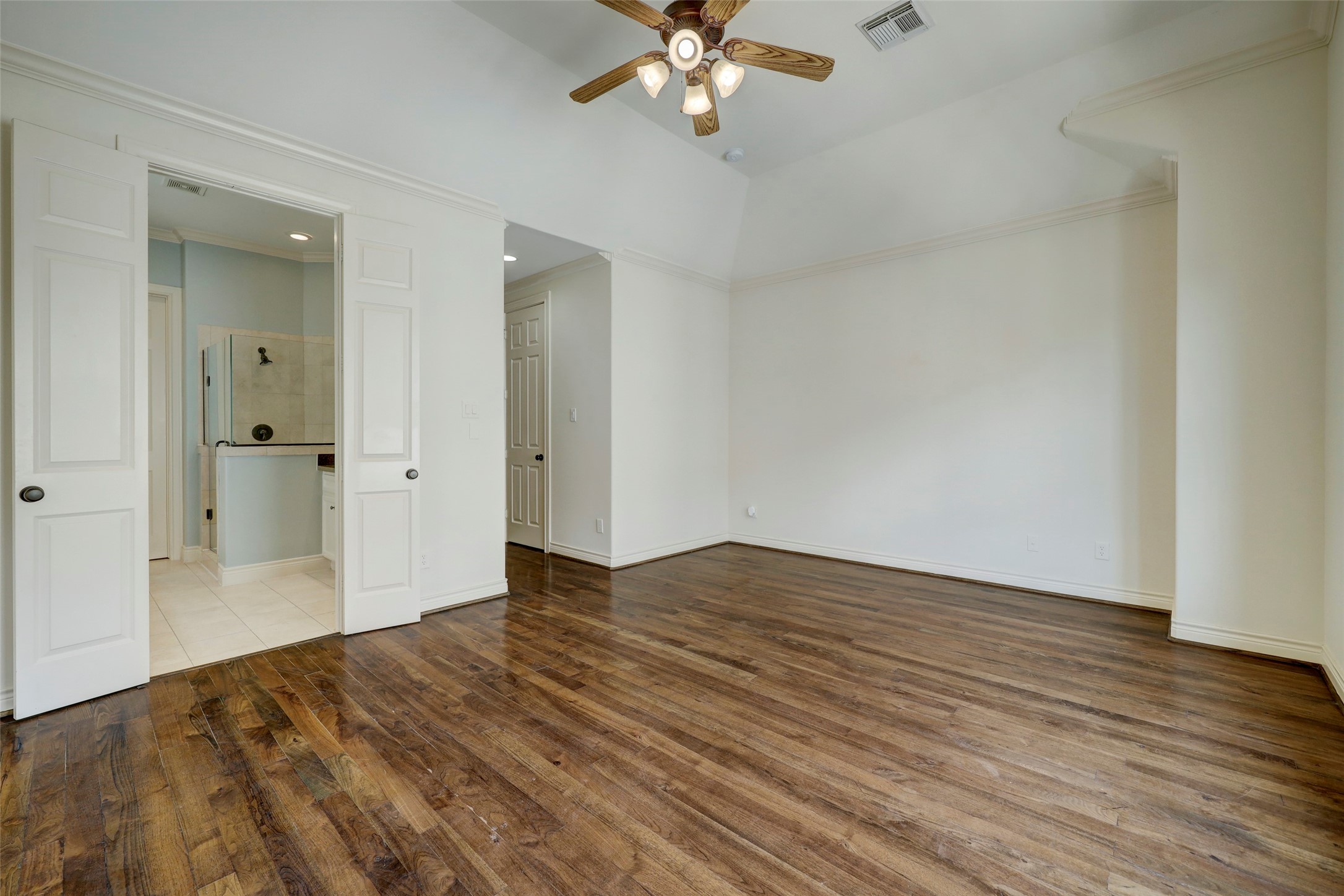 1436 Wichita Street Houston, TX 77004 - Photo 37 of 47 wooden floor in an empty room with a chandelier fan