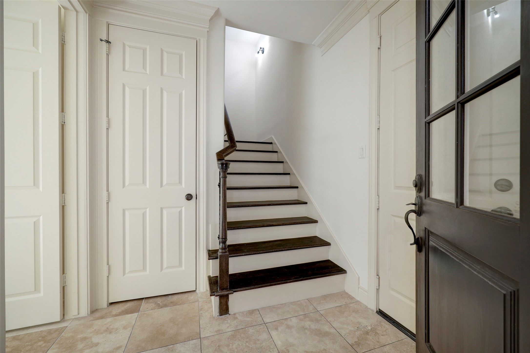 1436 Wichita Street Houston, TX 77004 - Photo 9 of 47 a view of a hallway with entryway wooden floor and front door