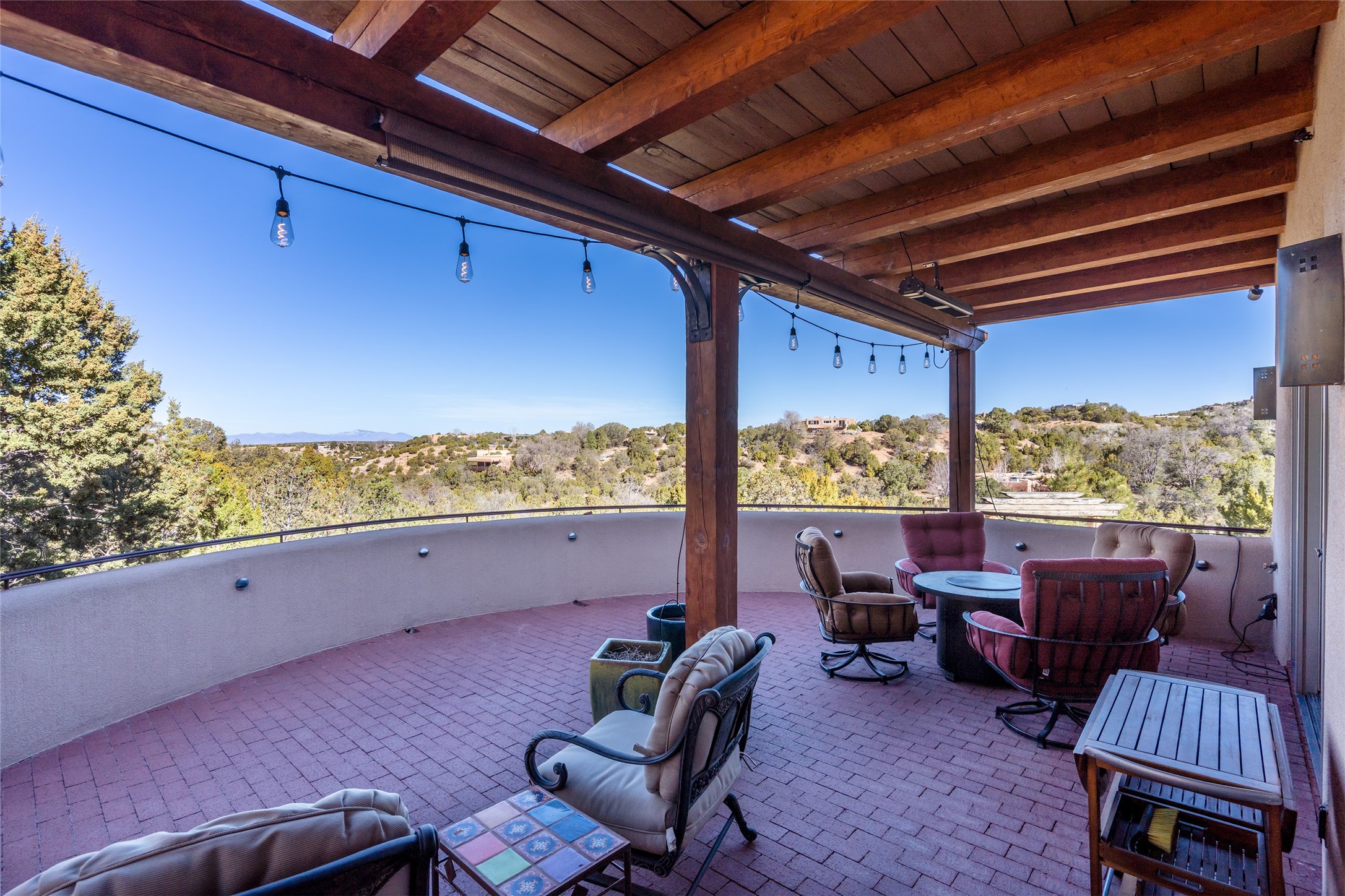 1204 Bandolina Road Santa Fe, NM 87501 - Photo 2 of 69 Upper patio/portal off of great room; view of Jemez Mountains