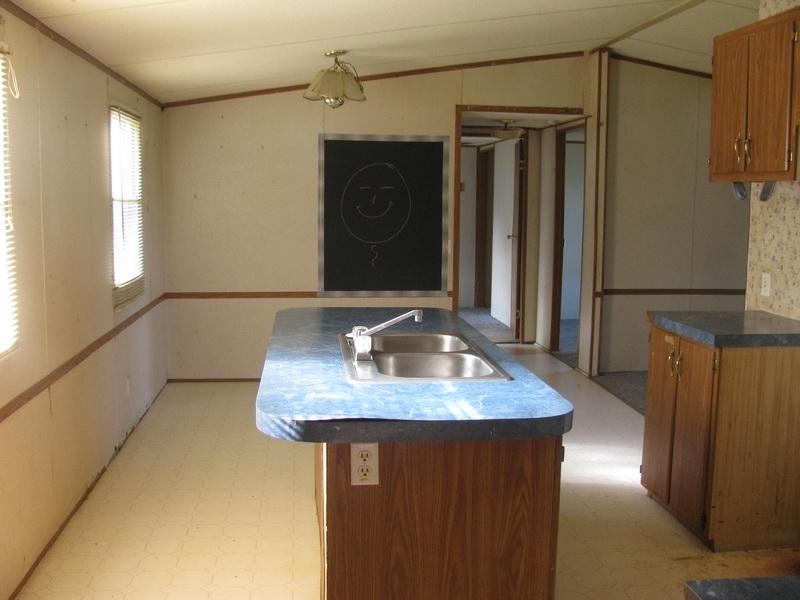 5310 Brush Creek Road Riner, VA 24149 - Photo 2 of 14 a bathroom with a sink a mirror and shower