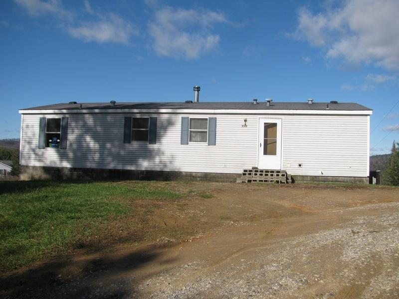 5310 Brush Creek Road Riner, VA 24149 - Photo 11 of 14 a front view of a house with garden