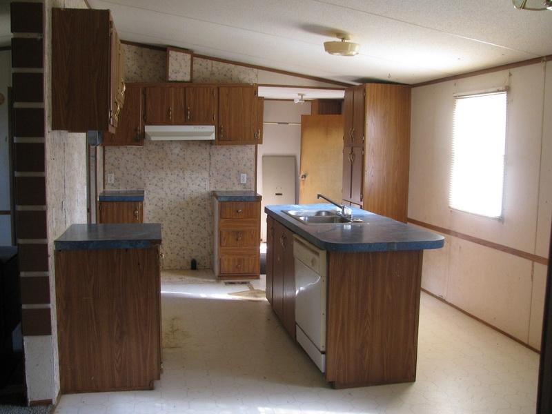 5310 Brush Creek Road Riner, VA 24149 - Photo 3 of 14 a kitchen with stainless steel appliances wooden cabinets a stove and a refrigerator