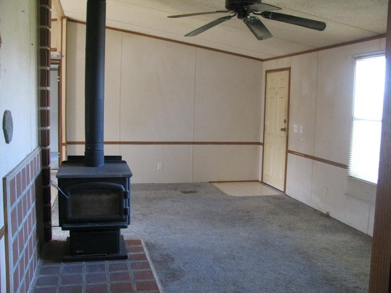 5310 Brush Creek Road Riner, VA 24149 - Photo 6 of 14 a view of a hallway with a window and a fireplace