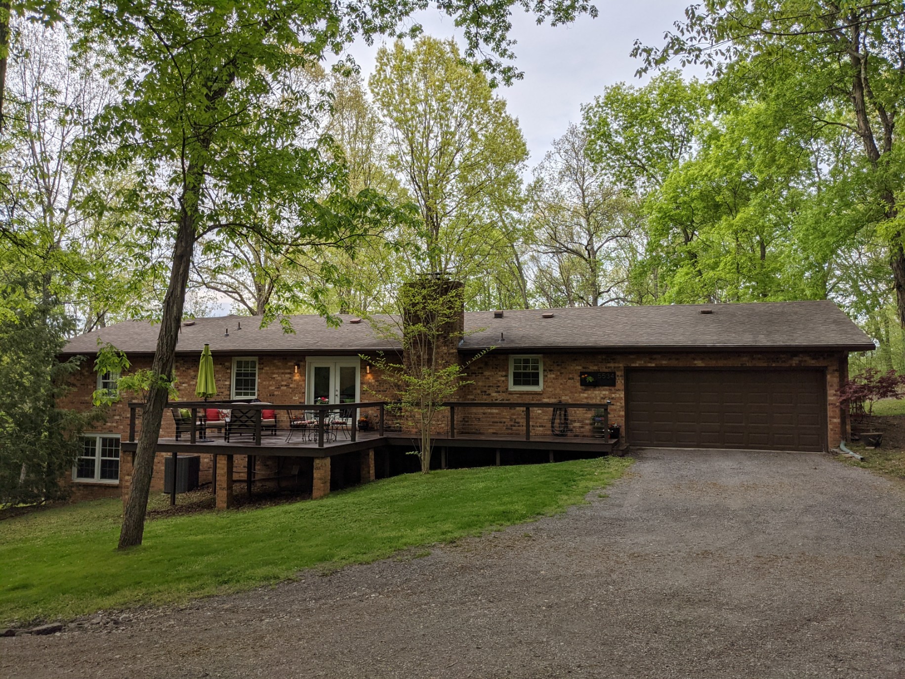 5534 Hickory Ridge Road Lebanon, TN 37090 - Photo 14 of 50 a front view of a house with a garden and trees