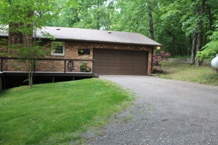 5534 Hickory Ridge Road Lebanon, TN 37090 - Photo 16 of 50 a front view of a house with a garden and yard