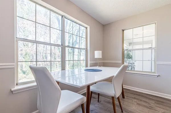 a view of a dining room with furniture window and outside view