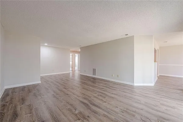 a bathroom with a sink a tub and a mirror