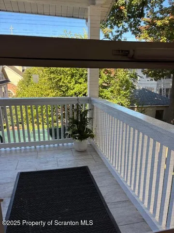 a view of balcony with furniture