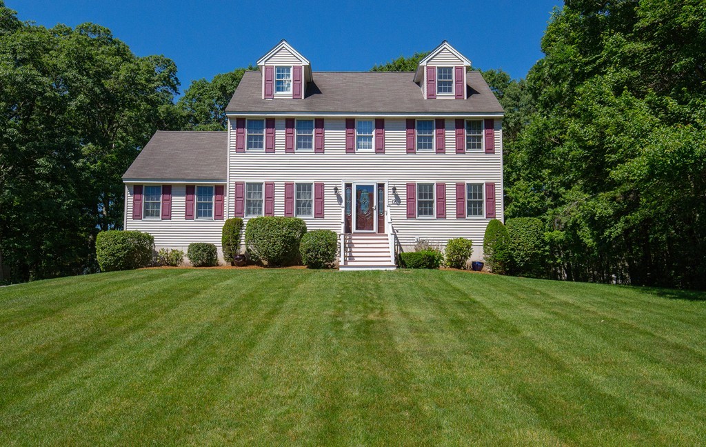 19 Gov Doherty Road Billerica, MA 01821 - Photo 1 of 28 a front view of a house with a yard and trees