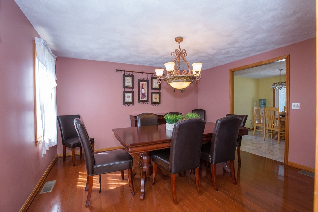 19 Gov Doherty Road Billerica, MA 01821 - Photo 11 of 28 a view of a dining room with furniture and wooden floor