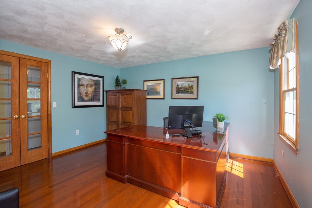 19 Gov Doherty Road Billerica, MA 01821 - Photo 13 of 28 a view of a workspace with furniture and a window