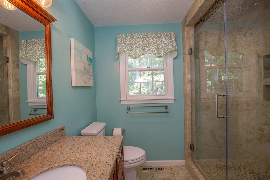 19 Gov Doherty Road Billerica, MA 01821 - Photo 18 of 28 a bedroom with a bed and a window