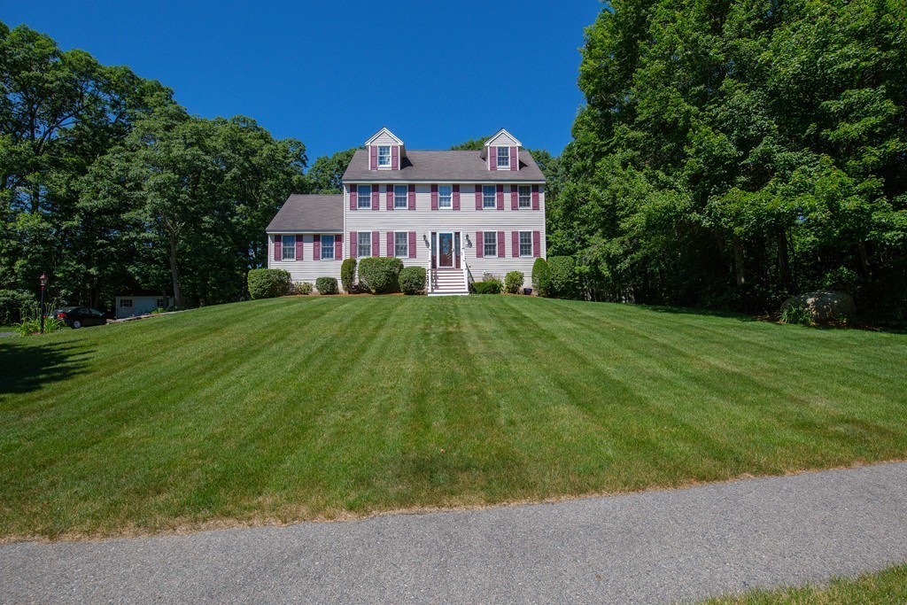 19 Gov Doherty Road Billerica, MA 01821 - Photo 27 of 28 a view of a big house with a big yard and large trees