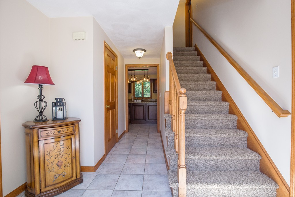 19 Gov Doherty Road Billerica, MA 01821 - Photo 3 of 28 a view of a hallway to rooms and stairs
