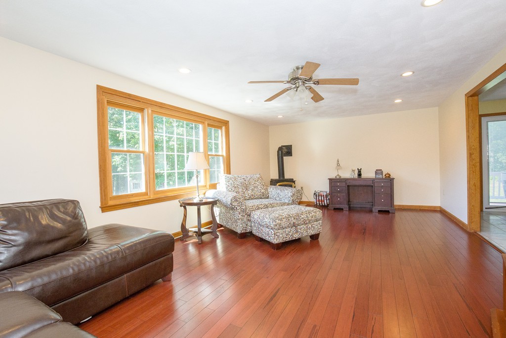 19 Gov Doherty Road Billerica, MA 01821 - Photo 9 of 28 a living room with furniture and a large window