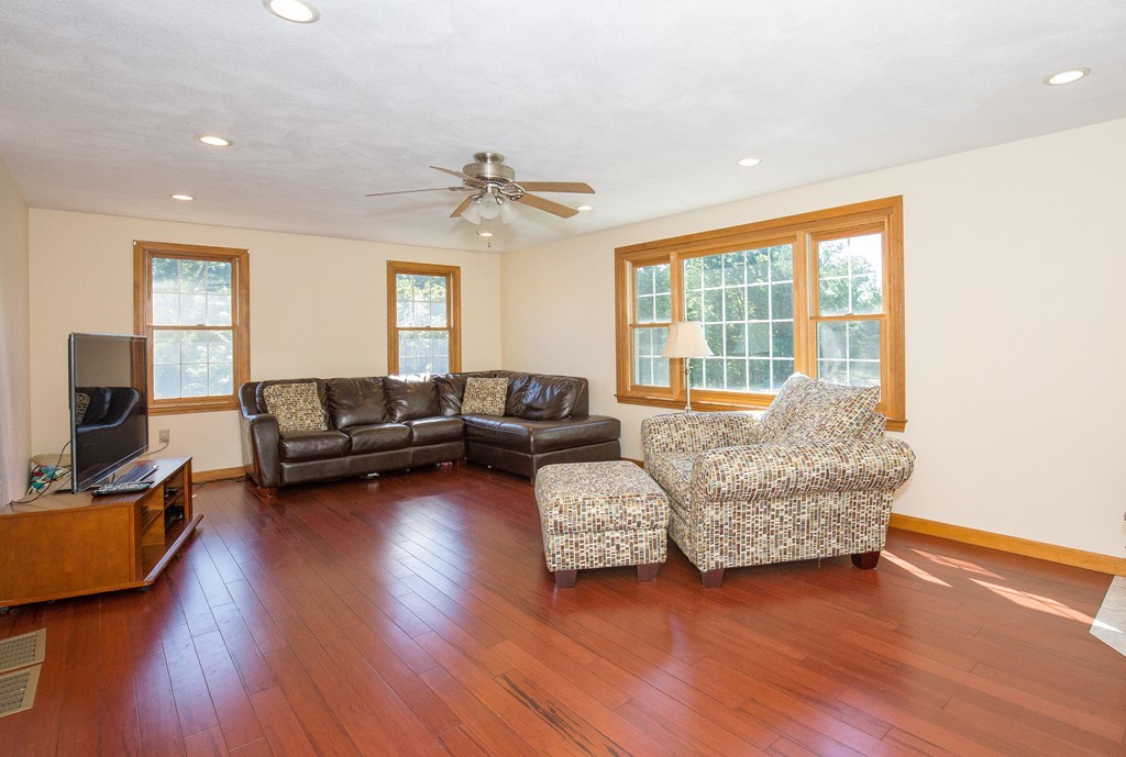 19 Gov Doherty Road Billerica, MA 01821 - Photo 10 of 28 a living room with furniture and a flat screen tv