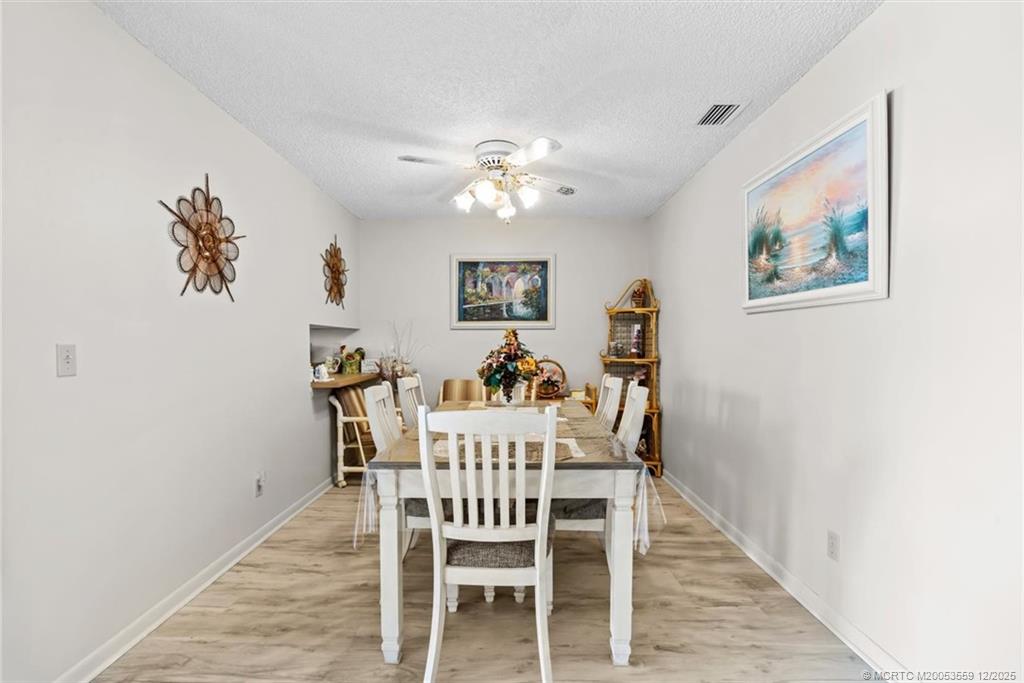 Undisclosed Address Stuart, FL 34994 - Photo 5 of 25 a view of a dining room with furniture