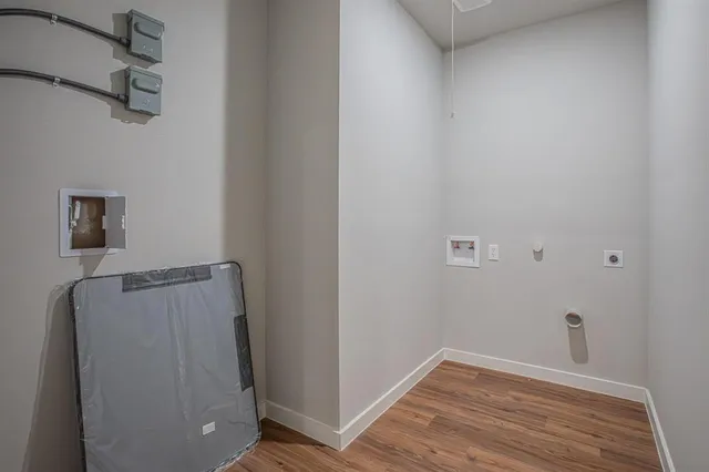 a view of hallway with wooden floor