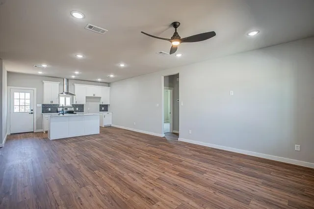 a view of kitchen with wooden floor and window