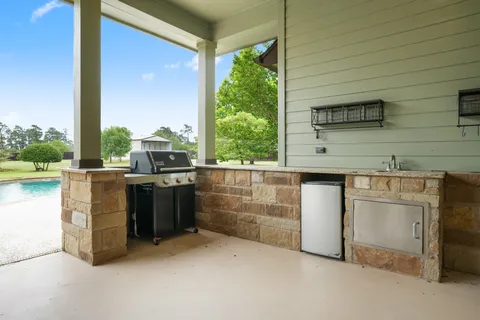 a kitchen with granite countertop cabinets washer and dryer