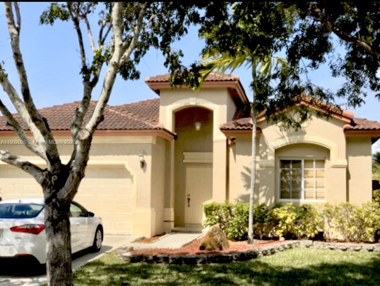 a front view of a house with lots of yellow lighting
